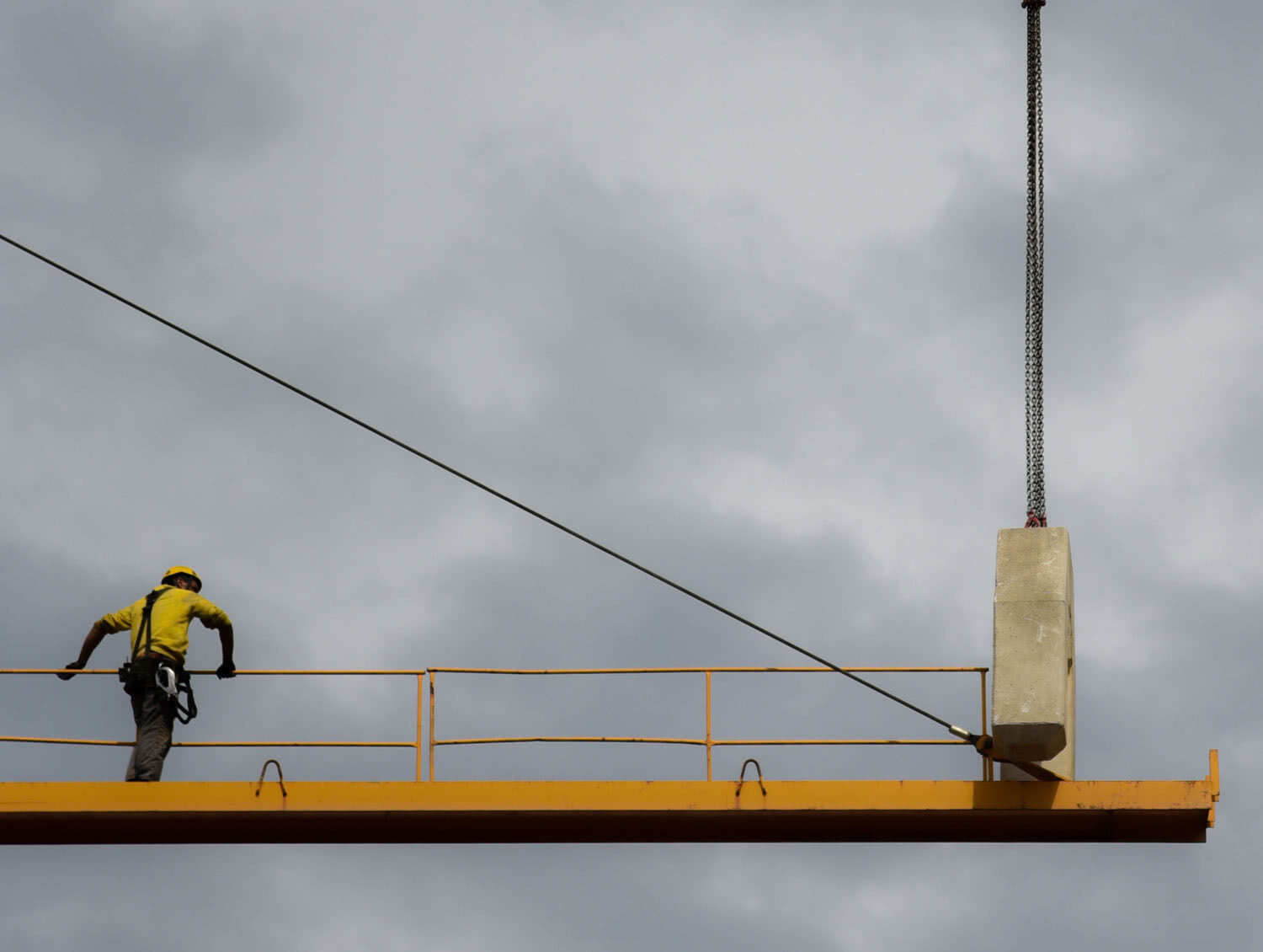 man-stand-on-crane man-stand-on-crane